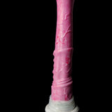 Pink horse-shaped dildo close-up, textured body and base ring