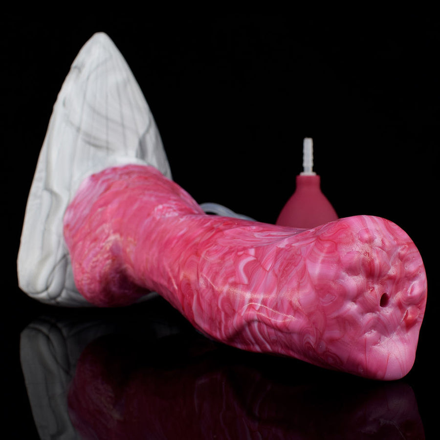 Pink fantasy werewolf-shaped sex toy with white muzzle and small nozzle attachment