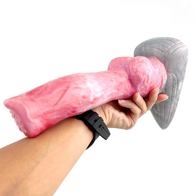 Pink fantasy werewolf sex toy held in hand with grey fin base