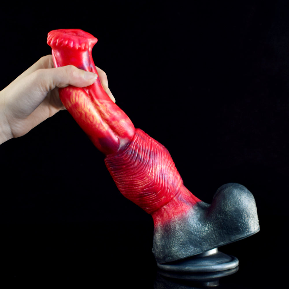 Horse dildo in hand: red ribbed shaft with dark flared base