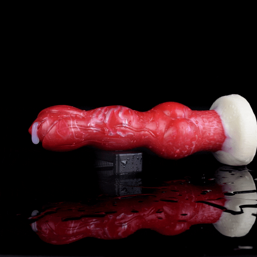 Red dog-shaped squeezable toy with white base, shown side view