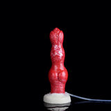 Red squirting dog dildo standing upright, thick knotted design, white base and tube