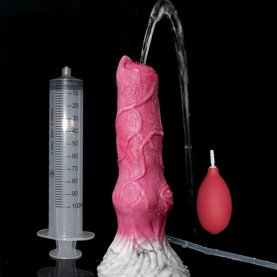 Pink realistic dog dildo with clear refill tube, scale marks, and small red nozzle