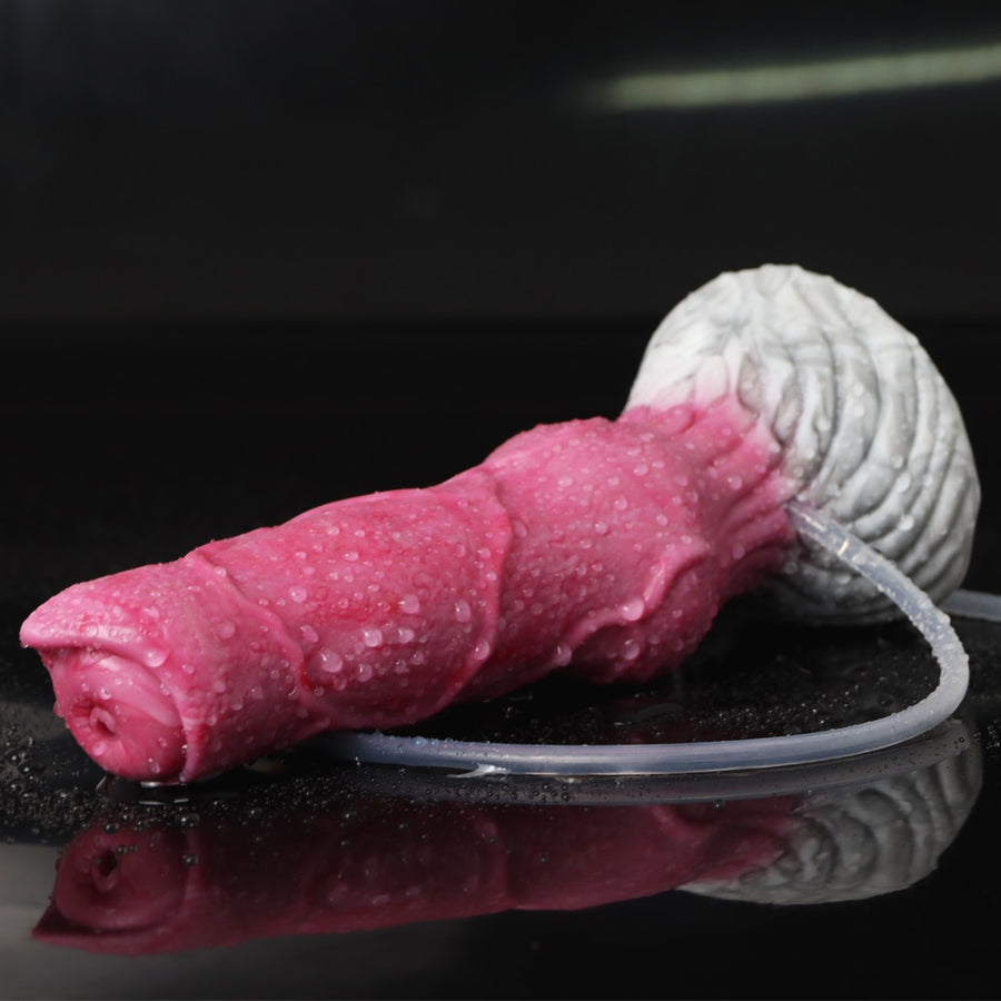 Pink realistic dog dildo lying down with clear tube and raised white tail detail