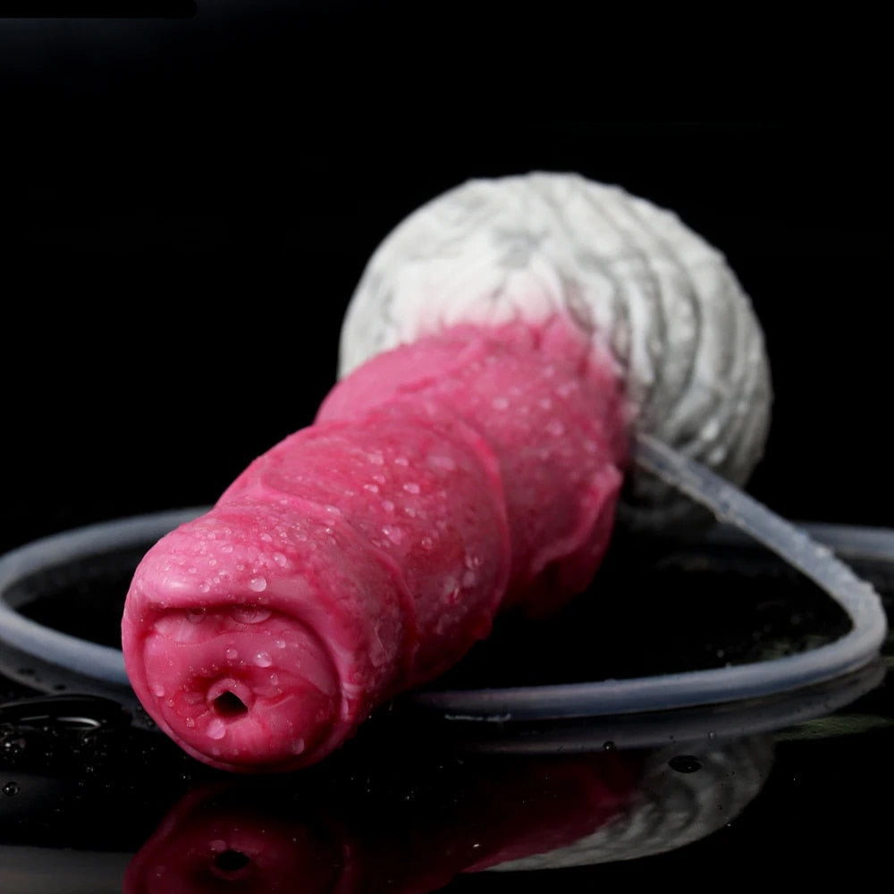 Realistic dog dildo tip, pink textured surface with clear tube loop