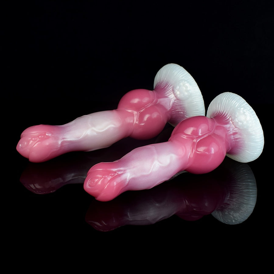 Two rosy pink dog-shaped dildo models with knots and white bases, lying side by side