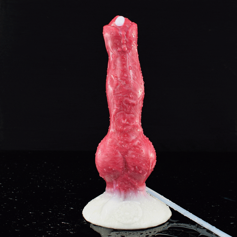 Tall red-pink canine-shaped sex toy with white base and clear tube nearby