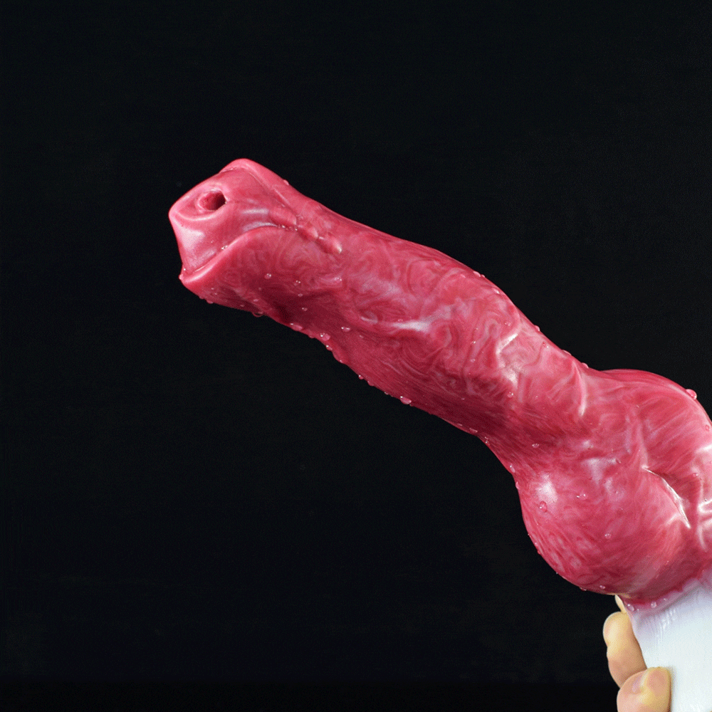 Canine-shaped sex toy with red-pink body, rounded base, and small nozzle detail