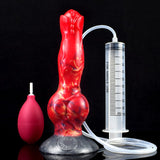 Red canine-shaped sex toy with squirting tube, syringe-style gauge, and bulb