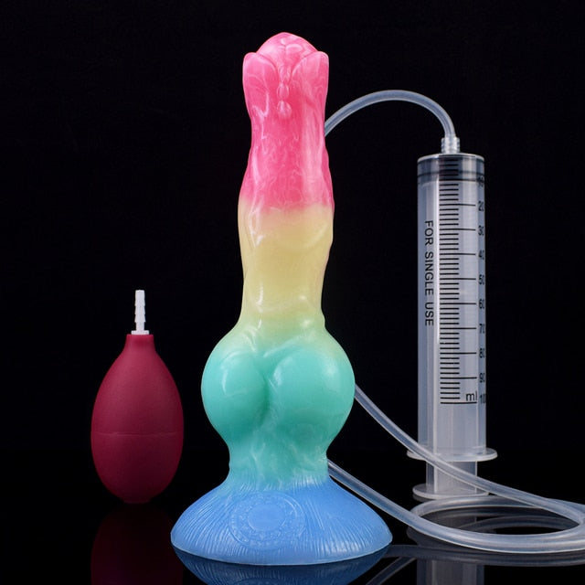 Color-shift canine-shaped sex toy with pink-to-yellow body, clear hose, gauge, and bulb
