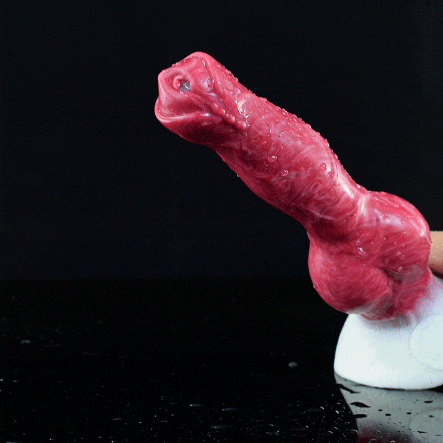 Red translucent canine knot sex toy, side view
