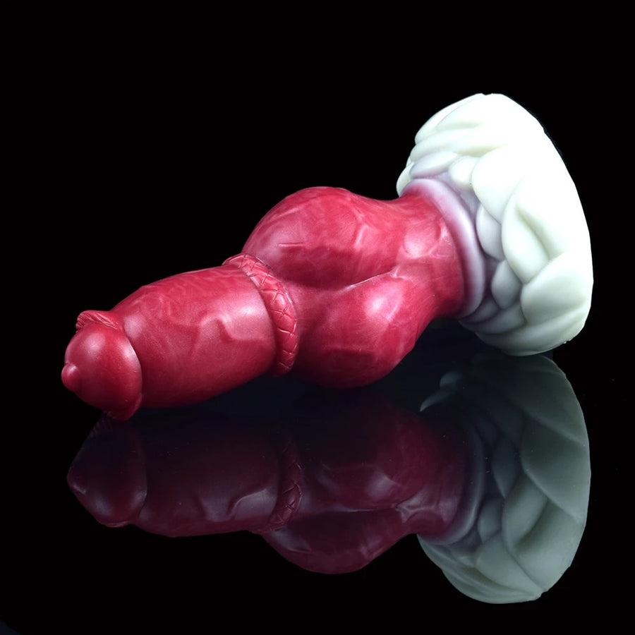 Canine-themed butt plug with maroon-red body, rounded tip, and white flared base