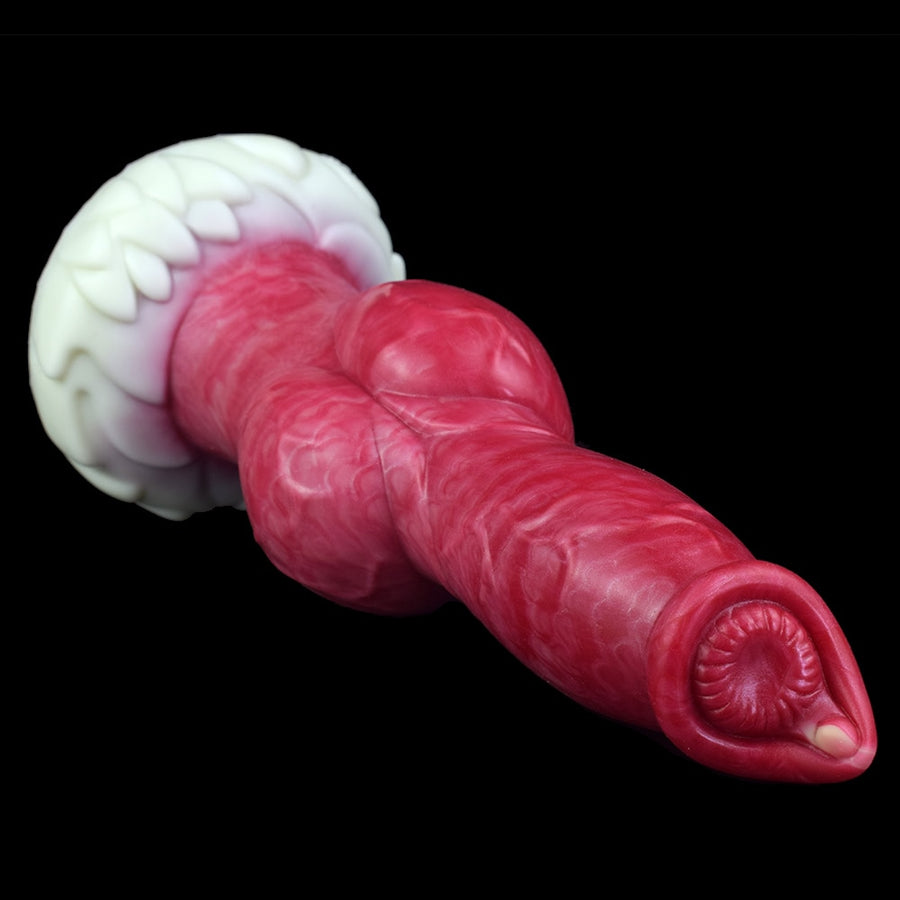 Realistic dog-themed sex toy close-up, pink snout tip and white knot surround.