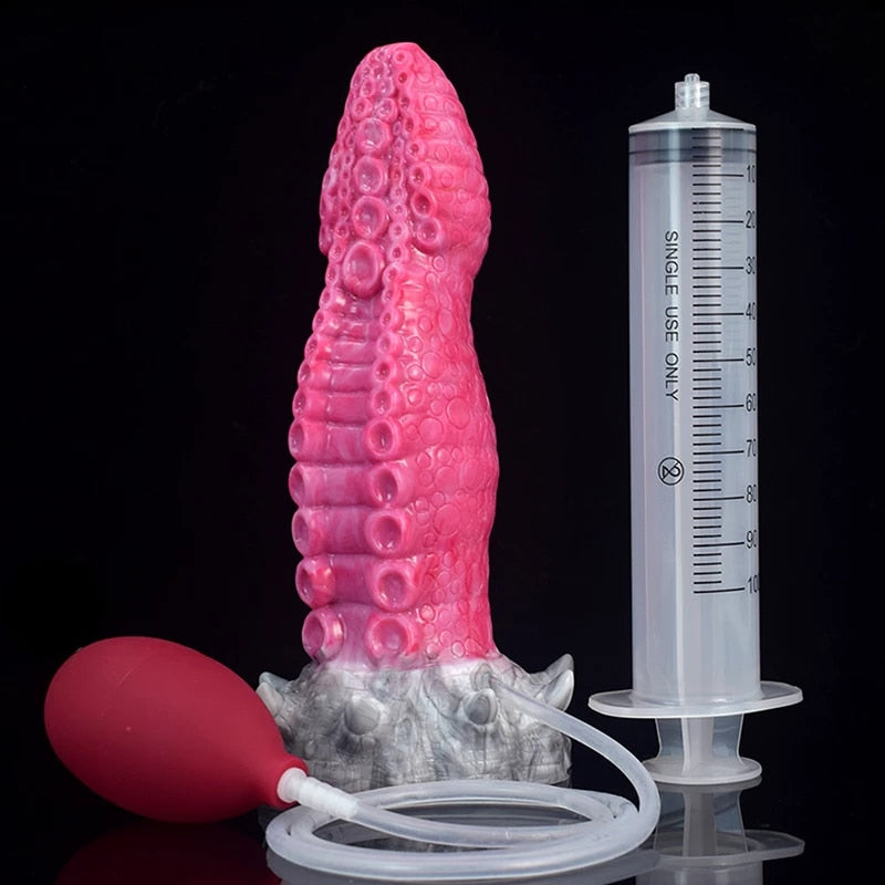 Octopus tentacle dildo, bright pink textured body with white head and measuring tube (Gory)