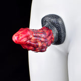 Dragon anal dildo with red swirled body and dark scaly base, side view