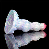 Side view: pastel blue fantasy dildo with red tip and large horn-shaped end.