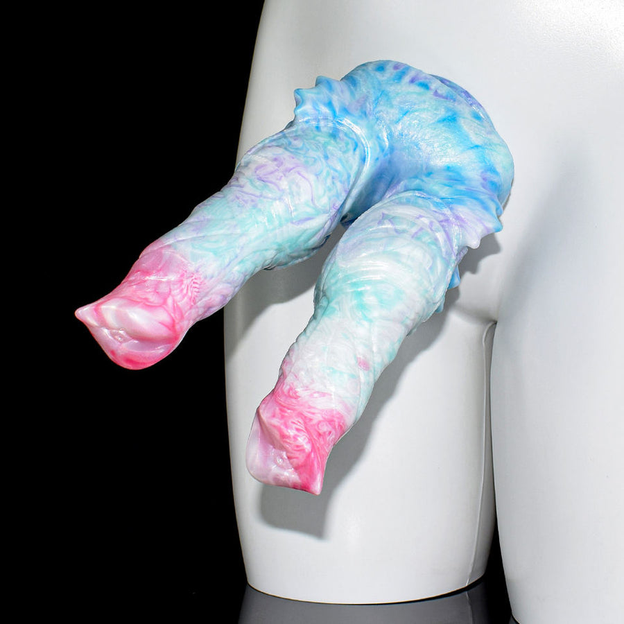 Two-hole butt plug with marbled blue, white, and pink double-prong design on display