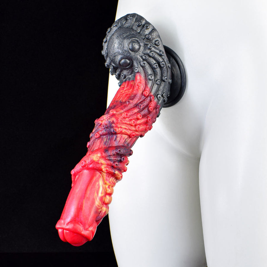 Side view of curved dragon dildo, red ribbed body with dark gray head and base