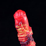 Head and upper shaft close-up: glossy red ribbed dragon dildo with dark metallic details
