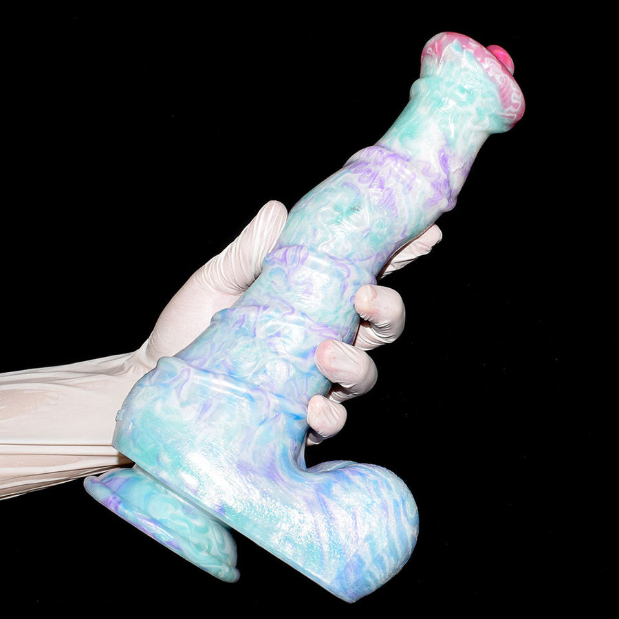 Curved horse-shaped sex toy held in a hand, pastel blue with purple swirls