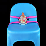 Tentacle toy on base with pink straps; rainbow tentacle head