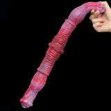 Curved double-ended horse dildo held in hand, textured pink-red surface with ribbed midsection