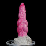 Double-knot alien dildo, glossy hot pink body with pale clear base and circular base ring.