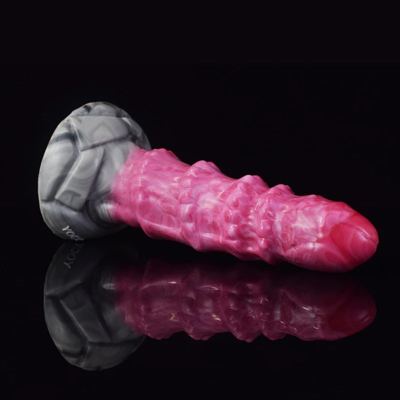 Pink ribbed octopus-style butt plug vibrator in side view with gray base.