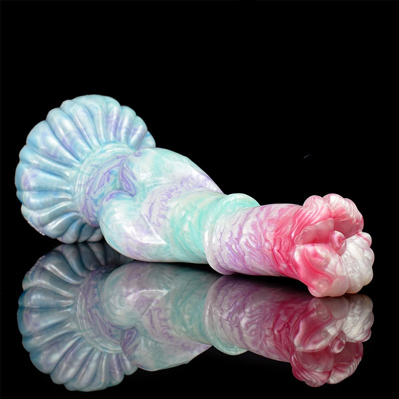Pastel pegasus-shaped sex toy dildo shown side-on, curled pink head and shell mane.