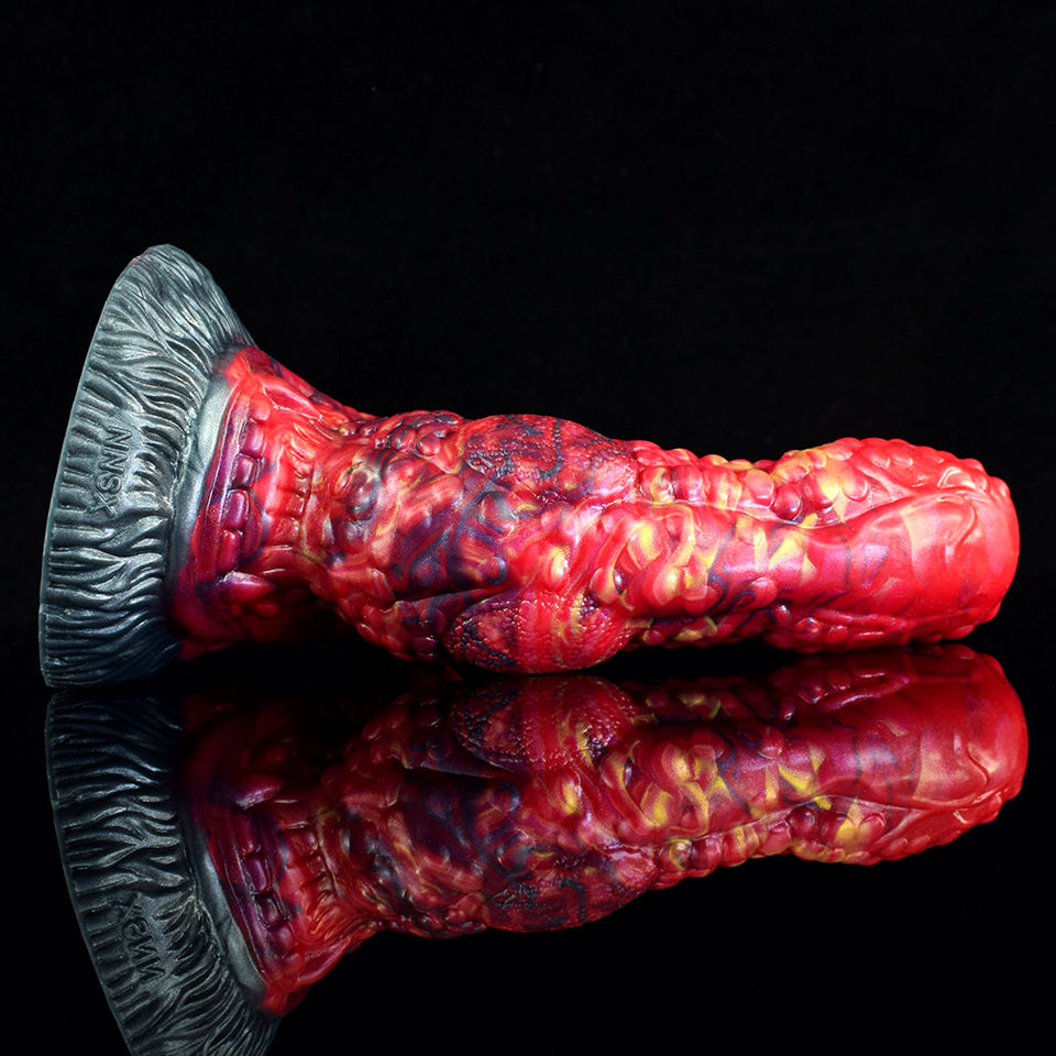 Curved red ribbed anal dildo with dark suction base and monster tongue detail