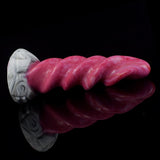 Pink swirled spiral tentacle dildo with ridged surface and white marble-look base, angled view