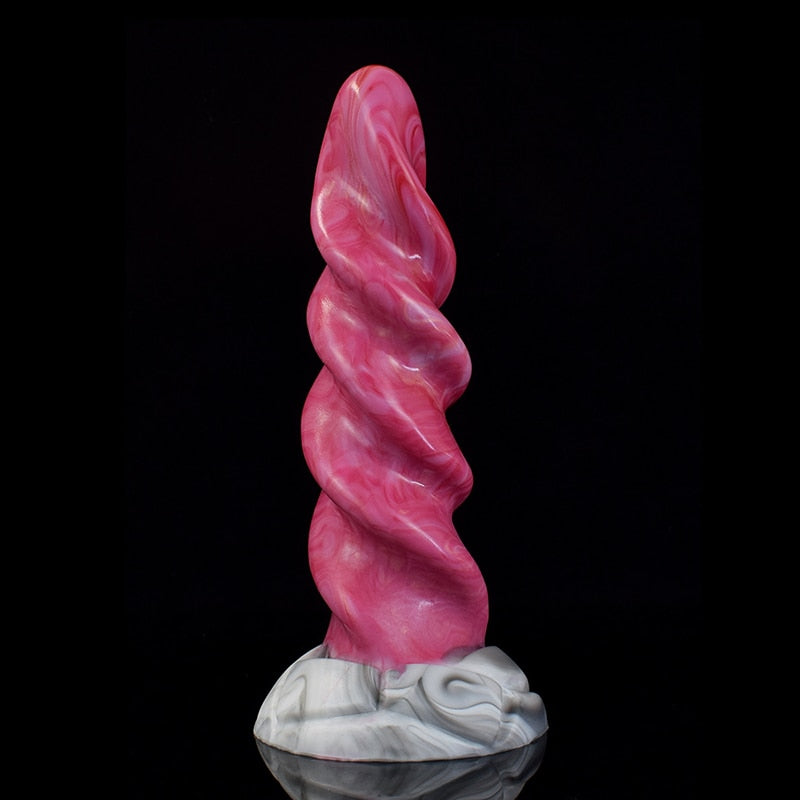 Pink spiral tentacle-shaped vibrator dildo with white marble-look base, side view