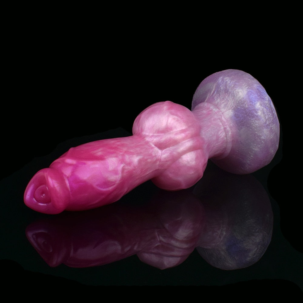Pink dog-shaped sex toy with large purple knot end and rounded muzzle, held