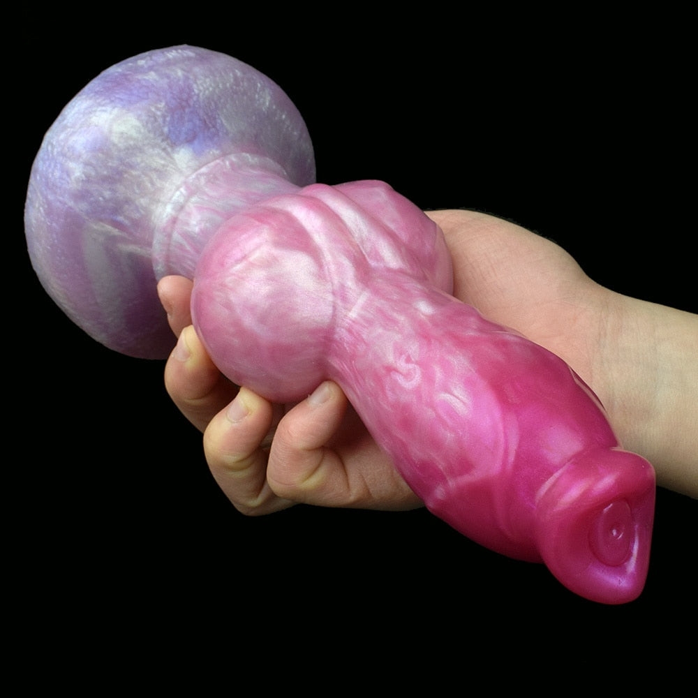 Hand holding pink-and-lilac dog sex toy, detailed muzzle end