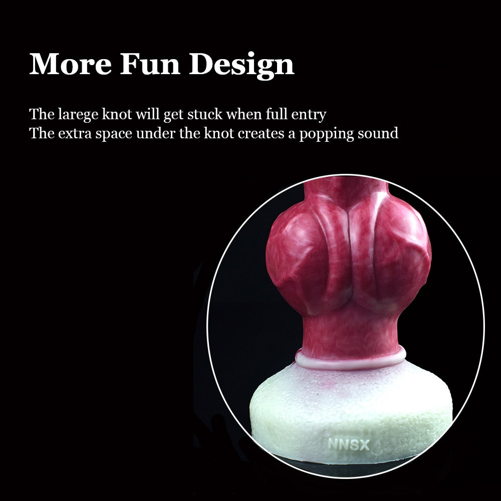 Knotted dog-themed dildo, knot area and white suction base shown in close-up