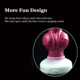 Knotted dog-themed dildo, knot area and white suction base shown in close-up