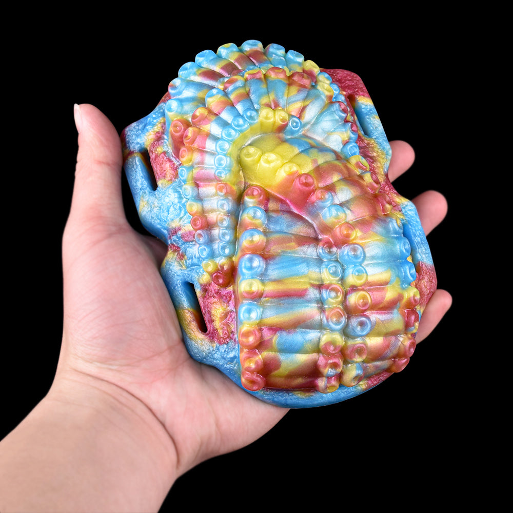Rainbow octopus grinder toy, close-up front view with raised tentacle texture