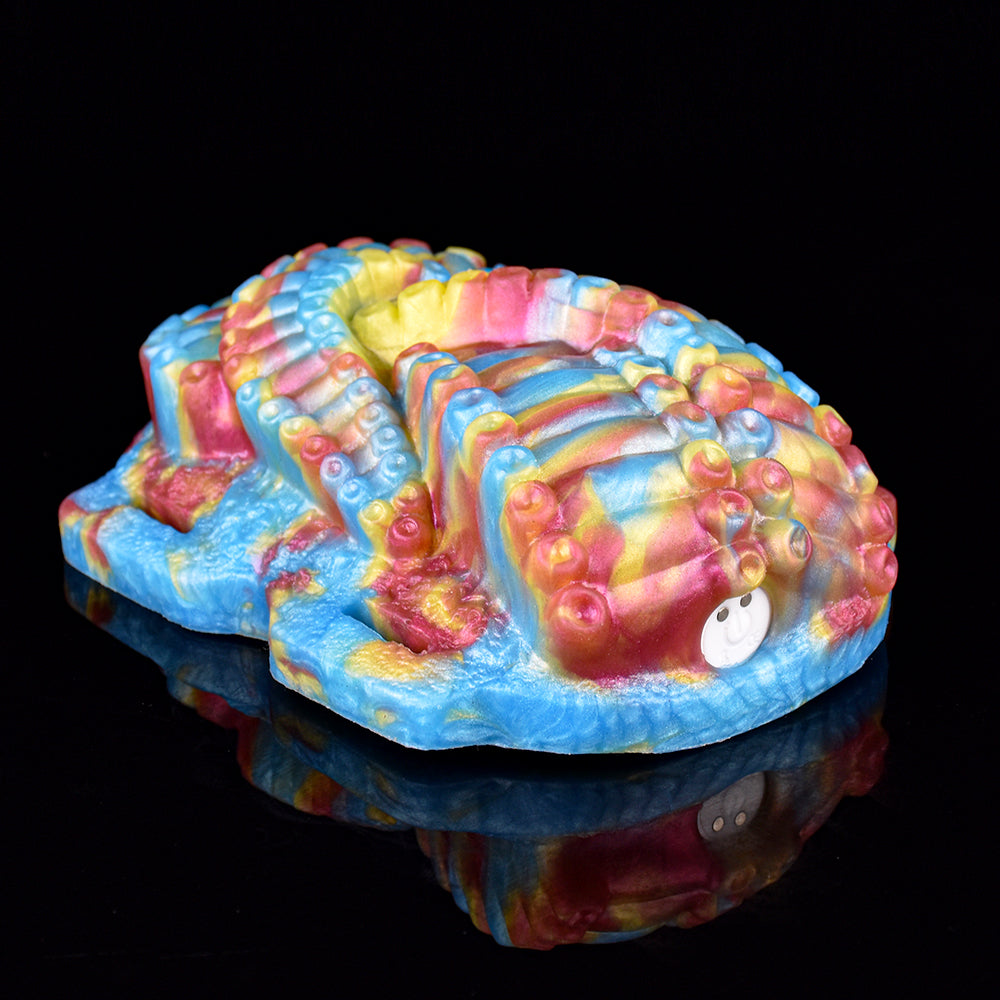 Rainbow octopus grinder toy with stitched strap attachment and molded details