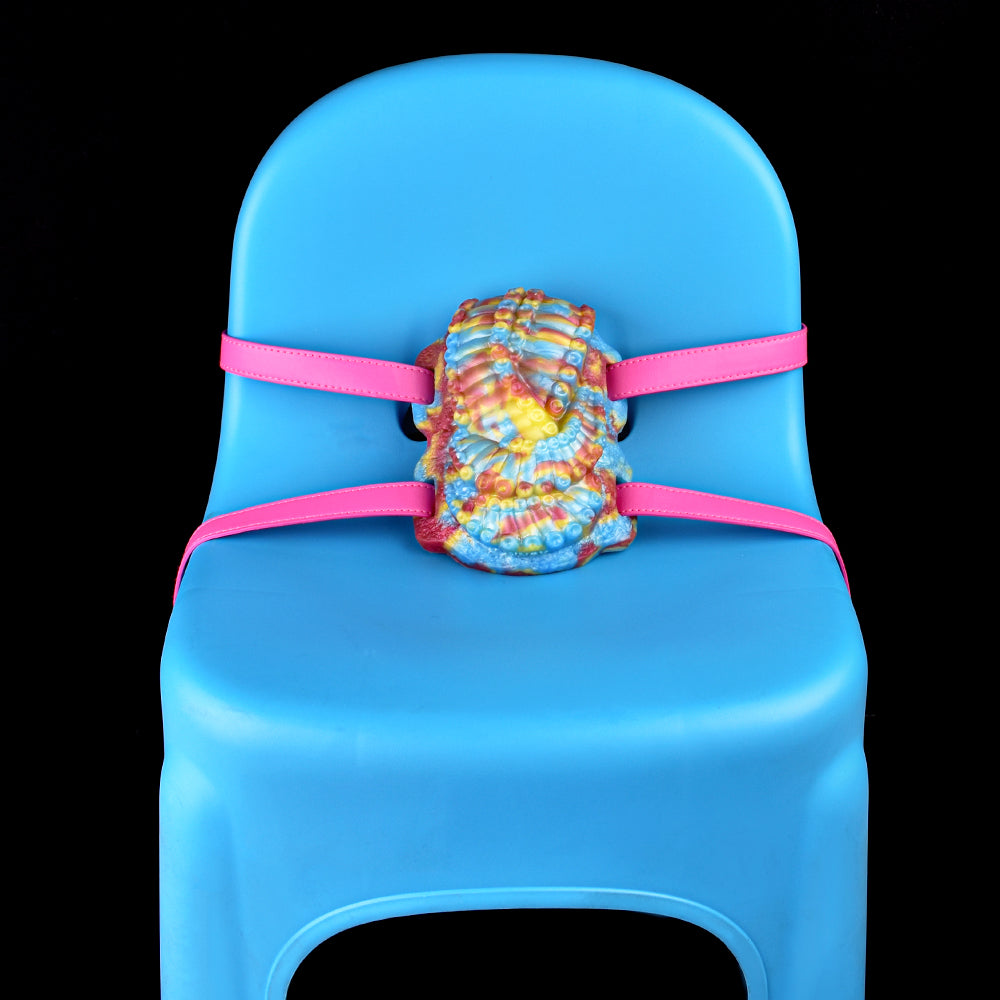 Octopus grinder toy centered on blue base with pink double straps