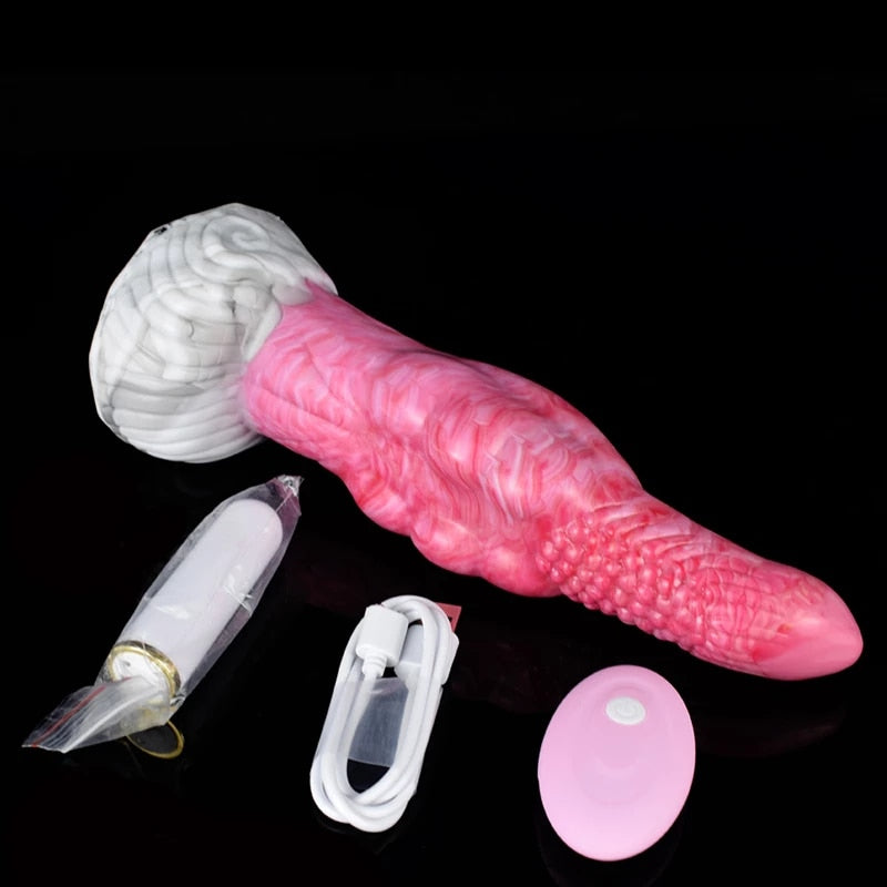Pink textured vibrating plug with round remote disc, charging case, and suction base