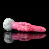 Side view of pink marbled butt plug vibrator with textured white base