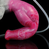 Pink translucent dog dildo close-up with attached clear tube