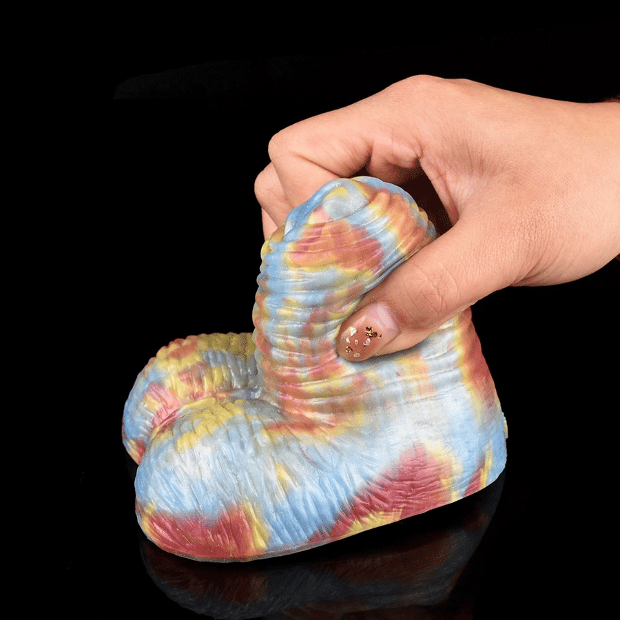 Tie-dye grinder with ridged spiral tip and heart base, light blue with pink accents
